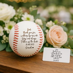 May include: A white baseball with red stitching and a handwritten message for the Father of the Bride. The message includes the date 10.08.2025 and the name Sarah. A small card with the same message is also present.