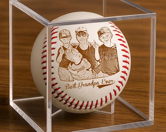 May include: A baseball with a custom engraved image of a family, displayed inside a clear acrylic cube. The baseball features red stitching and the text "Best Grandpa Ever". The image is a sepia tone.