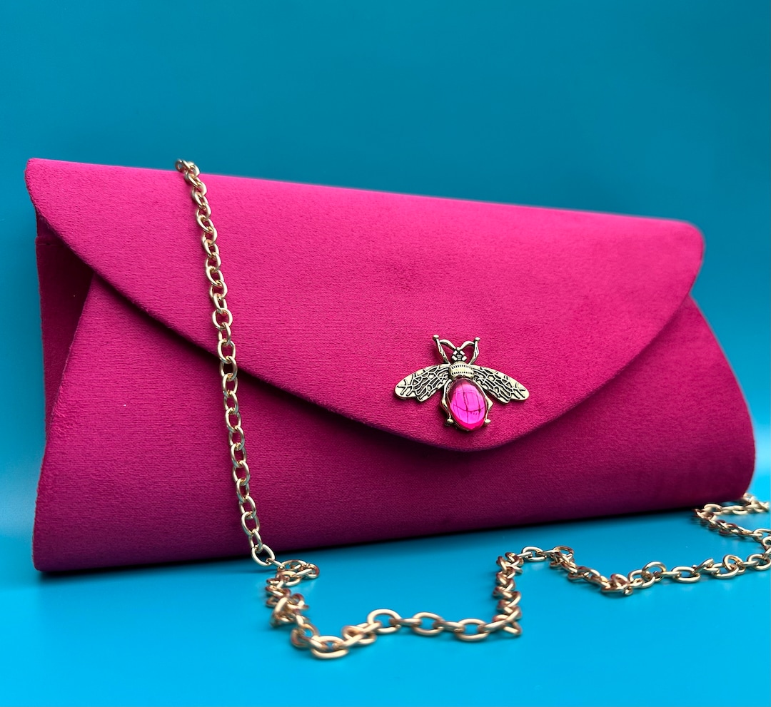 Red and pink clutch bag sales