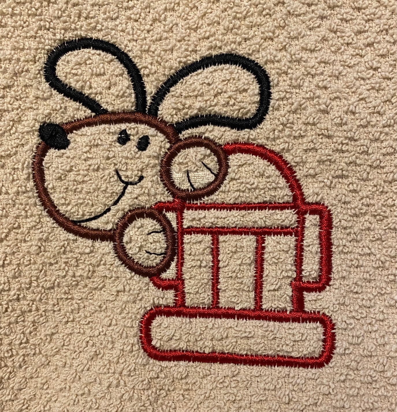 Hanging kitchen towel with embroidered Dog and Fire-hydrant outlines embroidered on towel