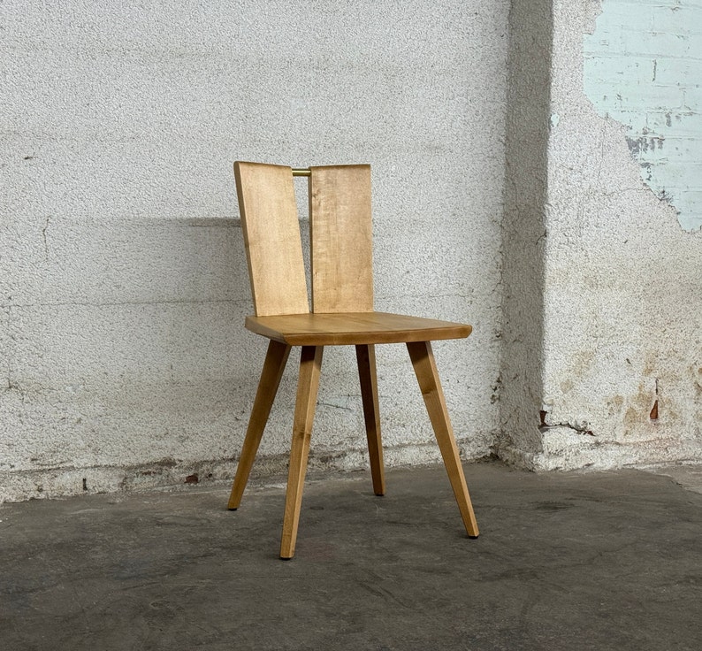 Sculptural solid wood slab chair, composed of three slabs of solid wood, 4 legs, and a satin brass connector