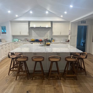 photo of modern swivel counter stool surrounding a modern kitchen island, made of solid oak, made in the USA by Marco Bogazzi
