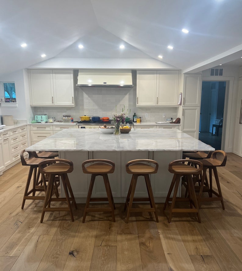 photo of modern swivel counter stool surrounding a modern kitchen island, made of solid oak, made in the USA by Marco Bogazzi