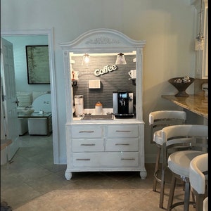 Distressed white coffee and wine armoire, grey pipe shelves, graystone beadboard, beverage bar, beverage station, wine bar, rustic farmhouse