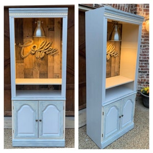 Beverage armoire bar, grayish-blue hue with antique white and distressed cabinets