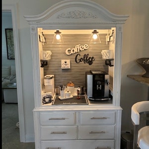 Distressed white coffee and wine armoire, grey pipe shelves, graystone beadboard, beverage bar, beverage station, wine bar, rustic farmhouse