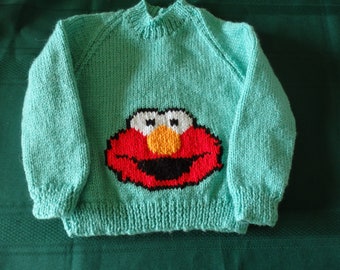 Hand knitted childs jumper featuring Elmo available in sizes 2 to 6,  choice of  colour