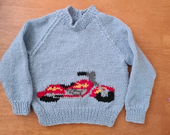 Hand knitted jumper, featuring a motorbike.