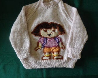 Hand Knitted jumper with Dora  available in sizes 2 to 6 and colour of your choice when ordering