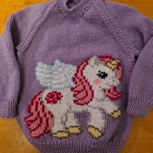 NEW - Hand knitted jumper featuring a beautiful unicorn, available in colour of your choice sizes 2 to 6