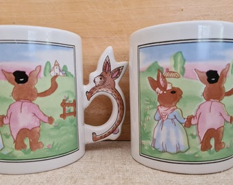 Vintage Easter mugs featuring 2 bunnies in a field.