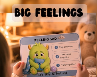 May include: A child holds a card with the text "BIG FEELINGS" and "FEELING SAD." The card features a green monster hugging a blue monster, with instructions: "Hug someone," "Take deep breaths," and "Talk together." The phrase "It's okay to feel sad" is also present.