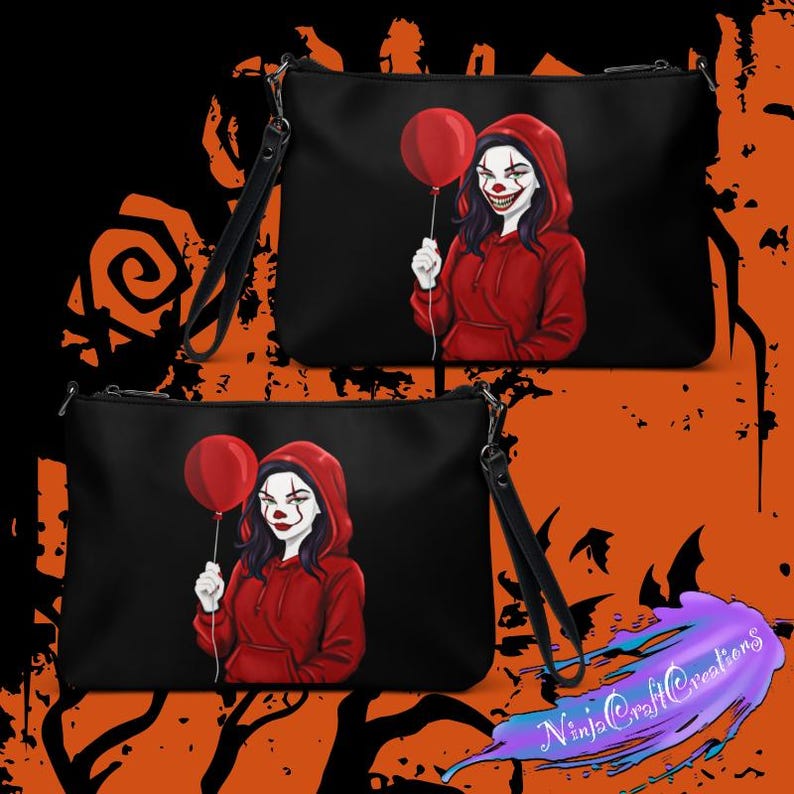 May include: Black clutch bags featuring a red-hooded clown holding a red balloon. The clown has white face paint and a sinister smile. Each bag has a black wrist strap. The background is black and orange.