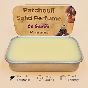 May include: A rectangular tin of Patchouli Solid Perfume, labelled "La boulle," containing 14 grams. The open lid shows a person using a dropper. The bottom of the tin has icons for "Natural Fragrance," "Long Lasting," and "Travel Friendly."