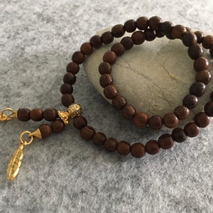 Bracelet wrap bracelet gold rain wood with intermediate parts made of silver gold plated