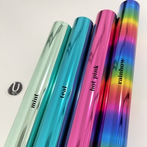 以下が含まれることがあります： 異なる色（ミント、ティール、ホットピンク、レインボー）のメタリックビニールロール4本