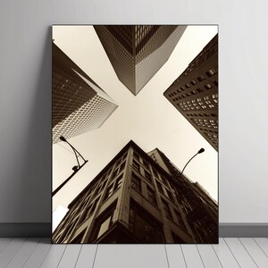 May include: A black and white photograph of a city skyline with tall buildings reaching up towards the sky. The buildings are seen from a low angle, giving the impression of looking up at them.
