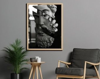 May include: Black and white photograph of a sculpture of a man's face, broken into pieces. The sculpture is framed in a light wood frame.