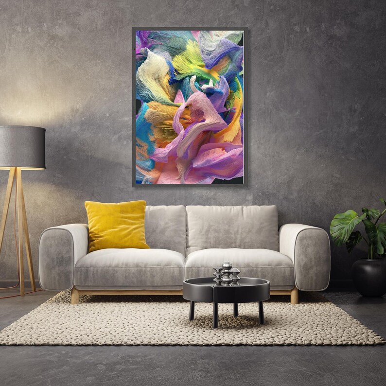 May include: Abstract painting with swirling colors of yellow, blue, green, pink, and white. The painting is framed in a black frame and is hanging on a gray wall.
