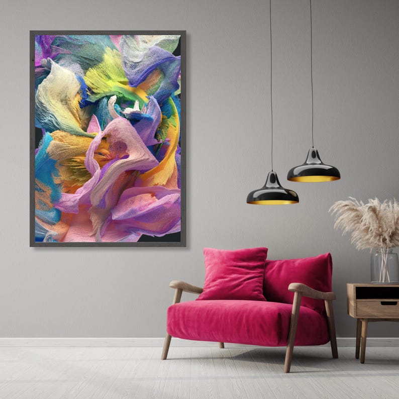 May include: Abstract painting in a black frame with swirling colors of blue, yellow, pink, and green. The painting is hanging on a gray wall above a pink armchair.