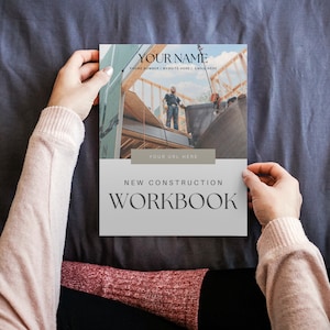 May include: A white and grey workbook with the text "NEW CONSTRUCTION WORKBOOK" and a photo of construction workers on a building site.
