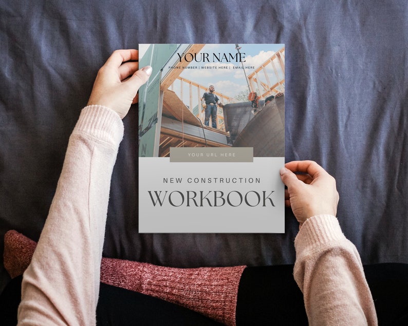 May include: A white and grey workbook with the text "NEW CONSTRUCTION WORKBOOK" and a photo of construction workers on a building site.