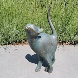 Beautiful bronze sculpture of a cat with a rounded back - Bronze garden decor