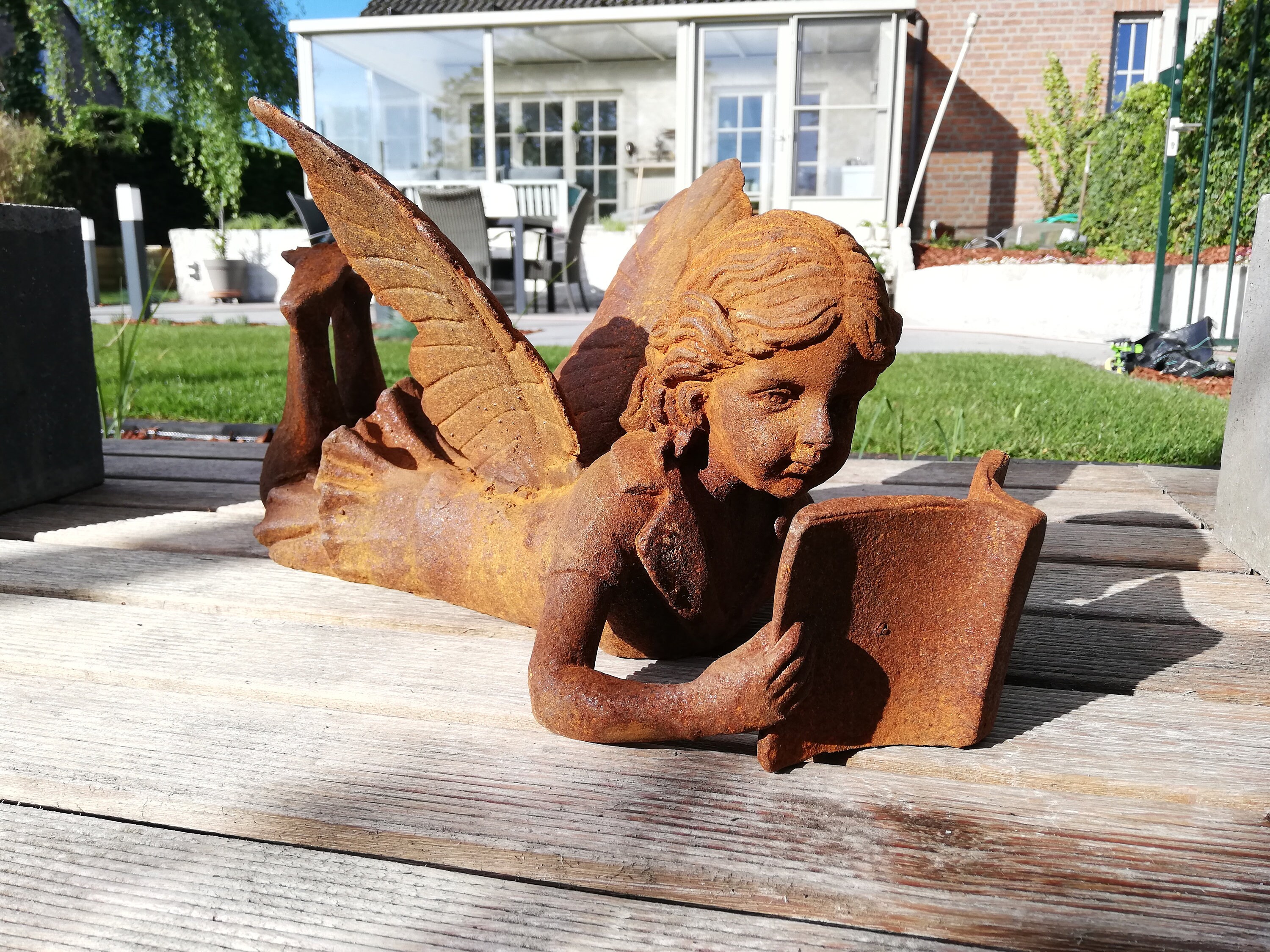 fairy reading a book statue