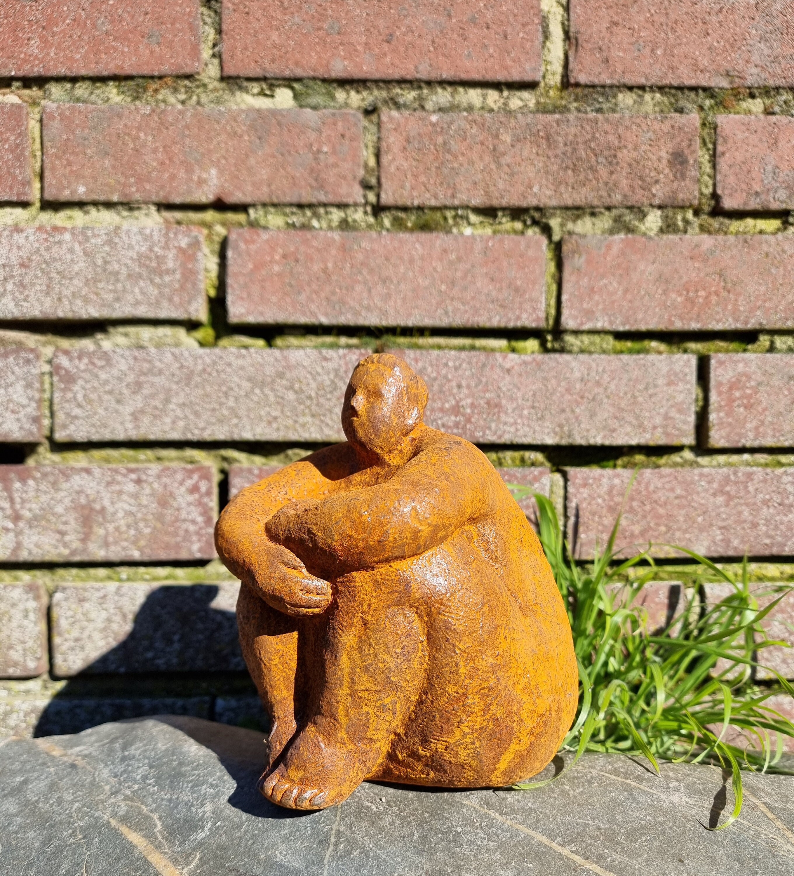 Sculpture of a dreaming lady Garden sculpture