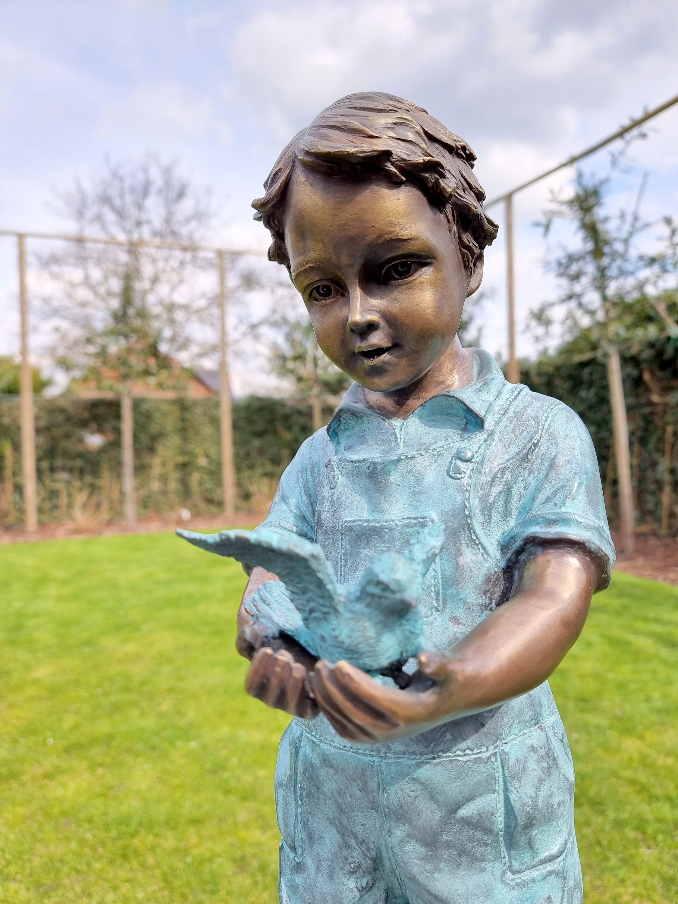 Bronze garden sculpture Boy with bird Bronze children pond sculpture