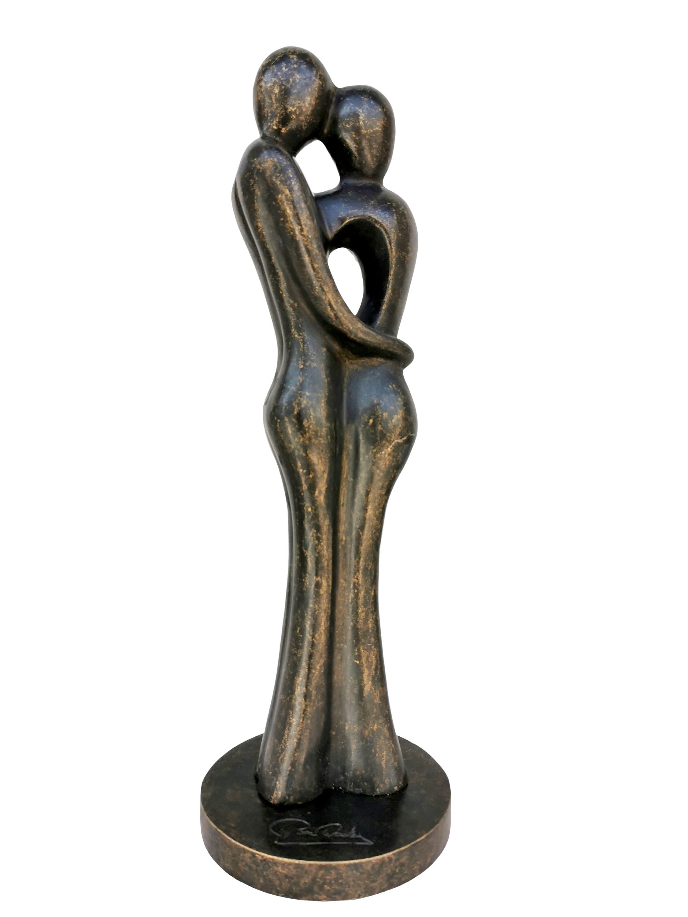 A bronze sculpture of a loving couple