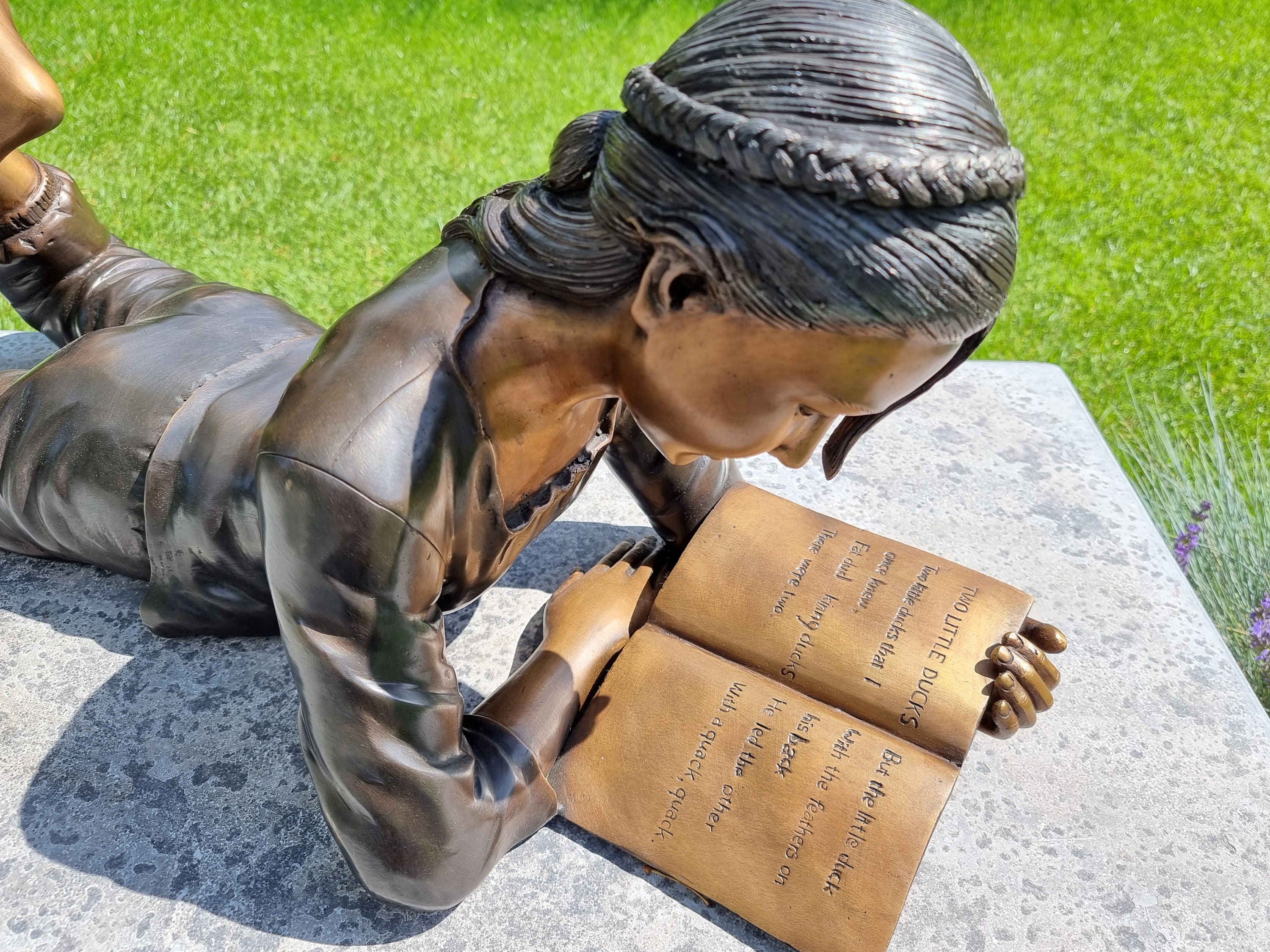 Bronze garden sculpture Girl reading a book Bronze children