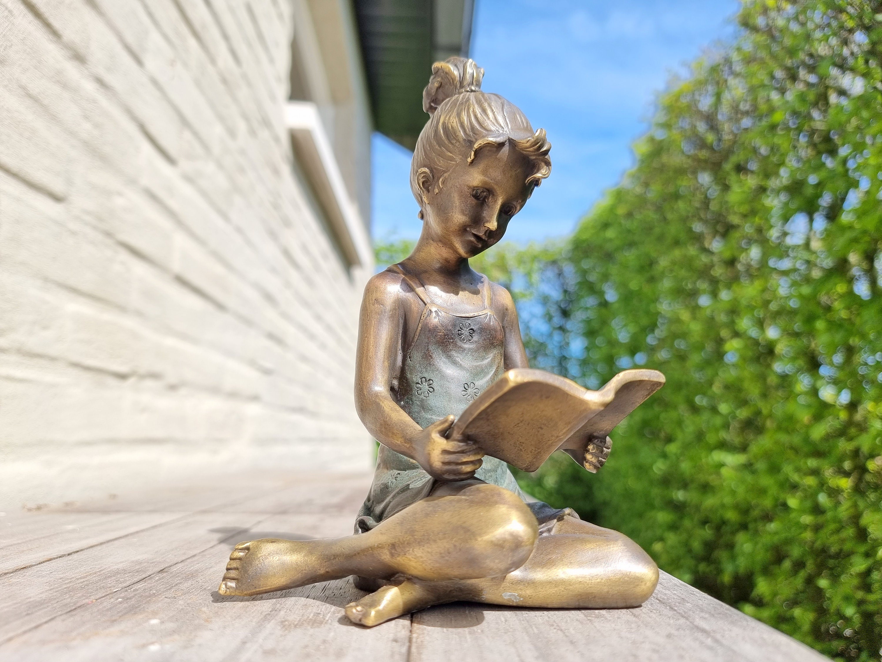 Bronze sculpture of a girl reading a book Bronze garden ornaments