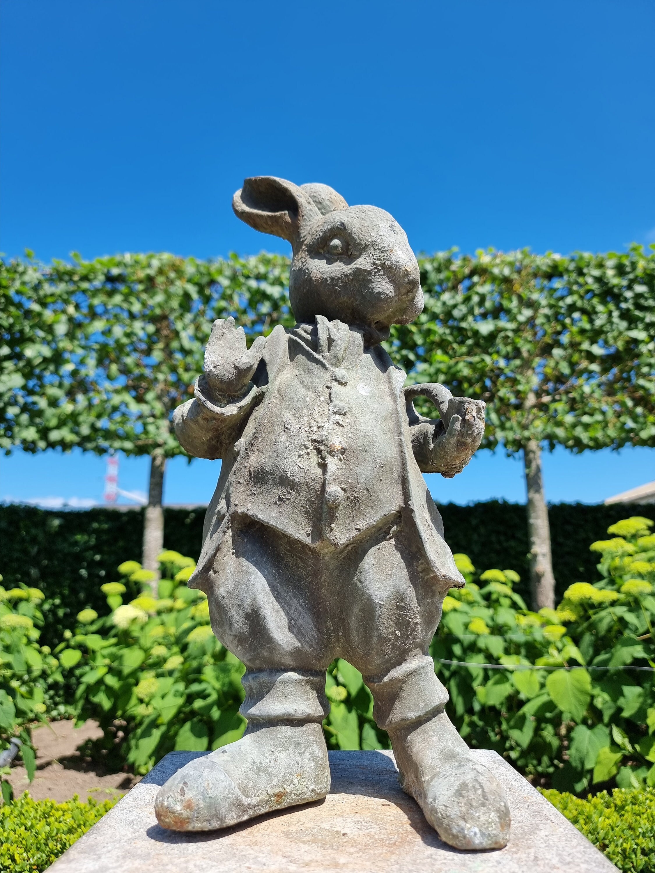 Cast iron garden sculpture of a Hare with pipe Dressed Hare