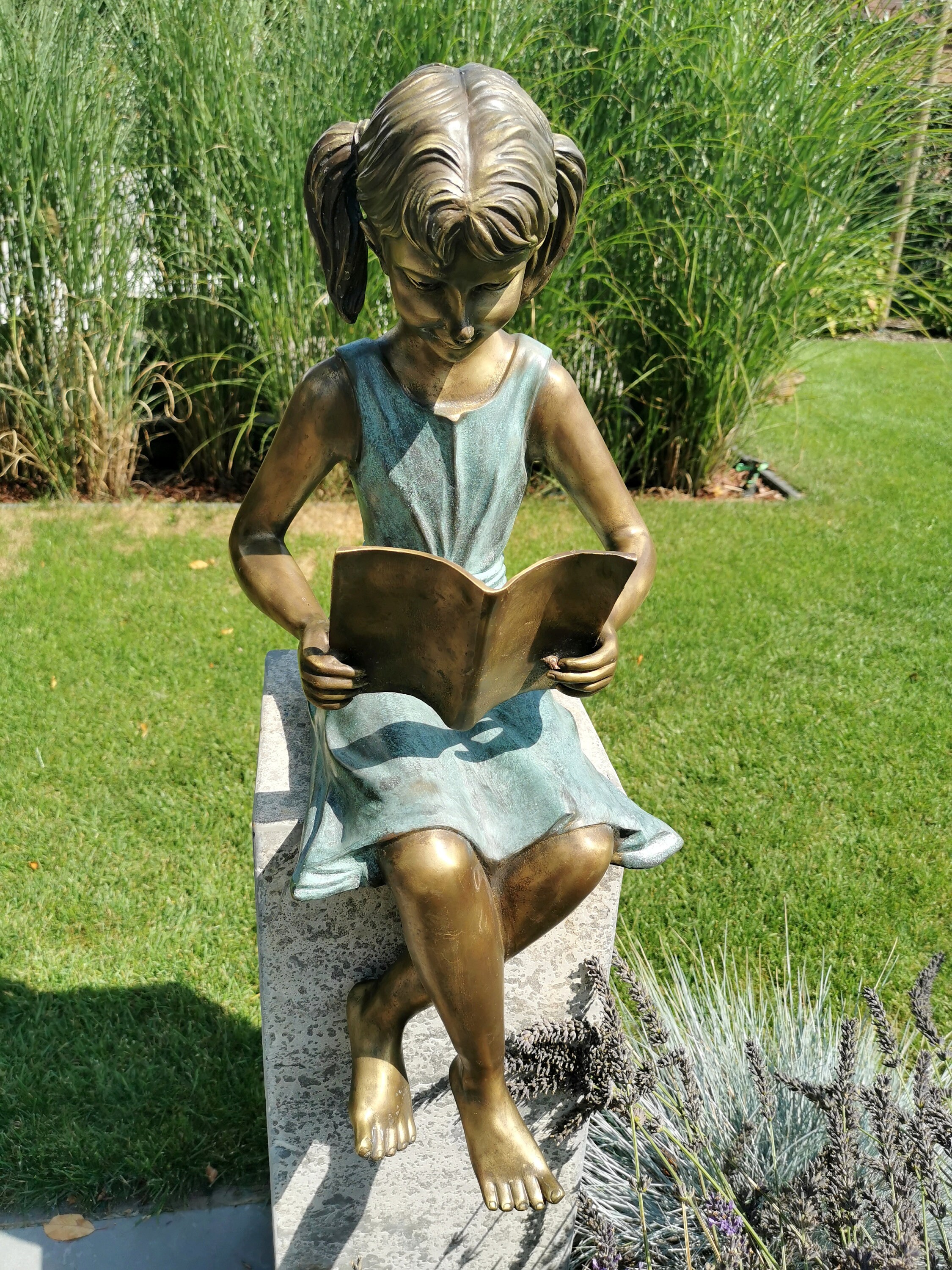 Bronze garden sculpture Girl reading a book Bronze children