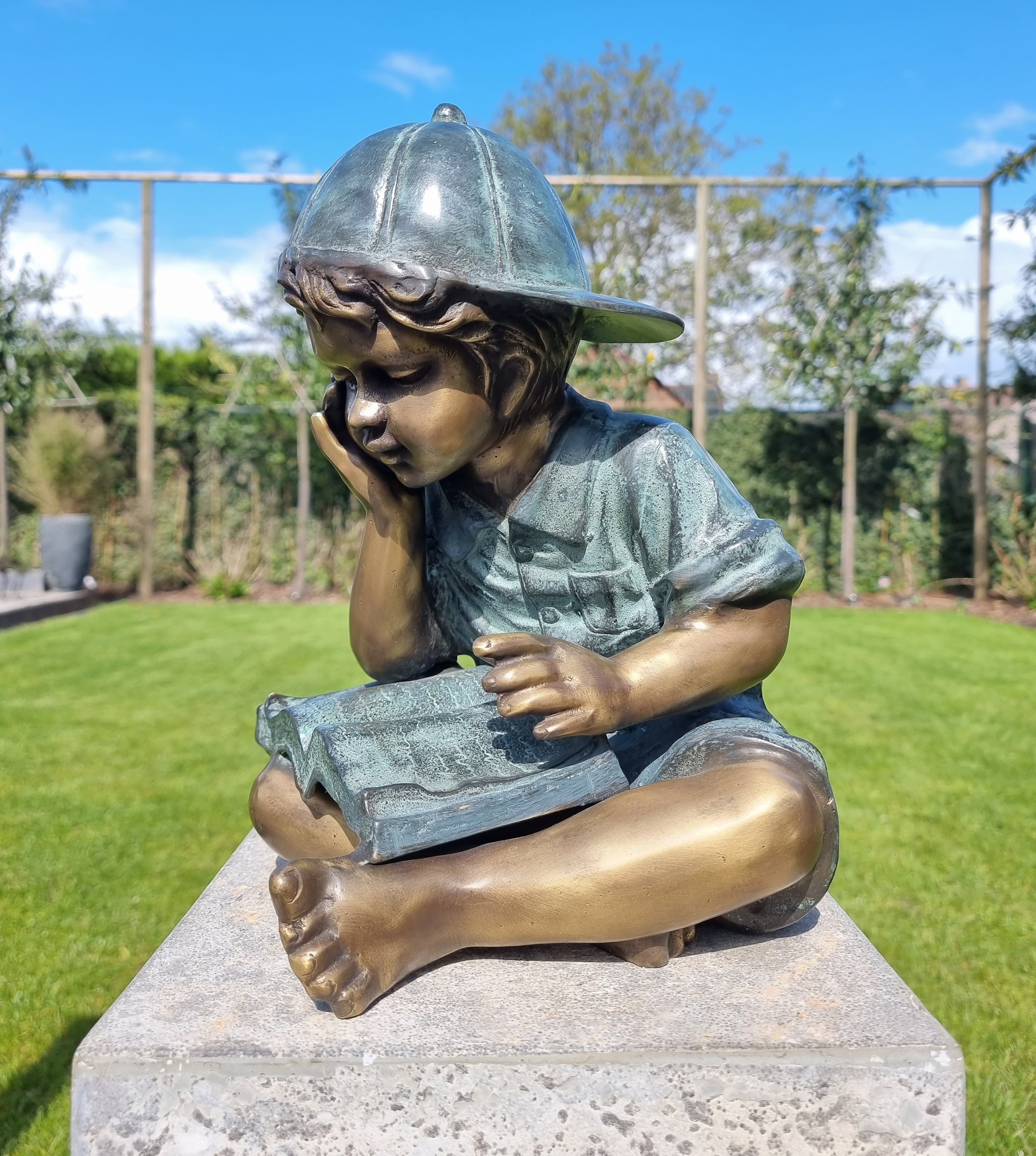 Bronze garden sculpture Boy reading a book Bronze children