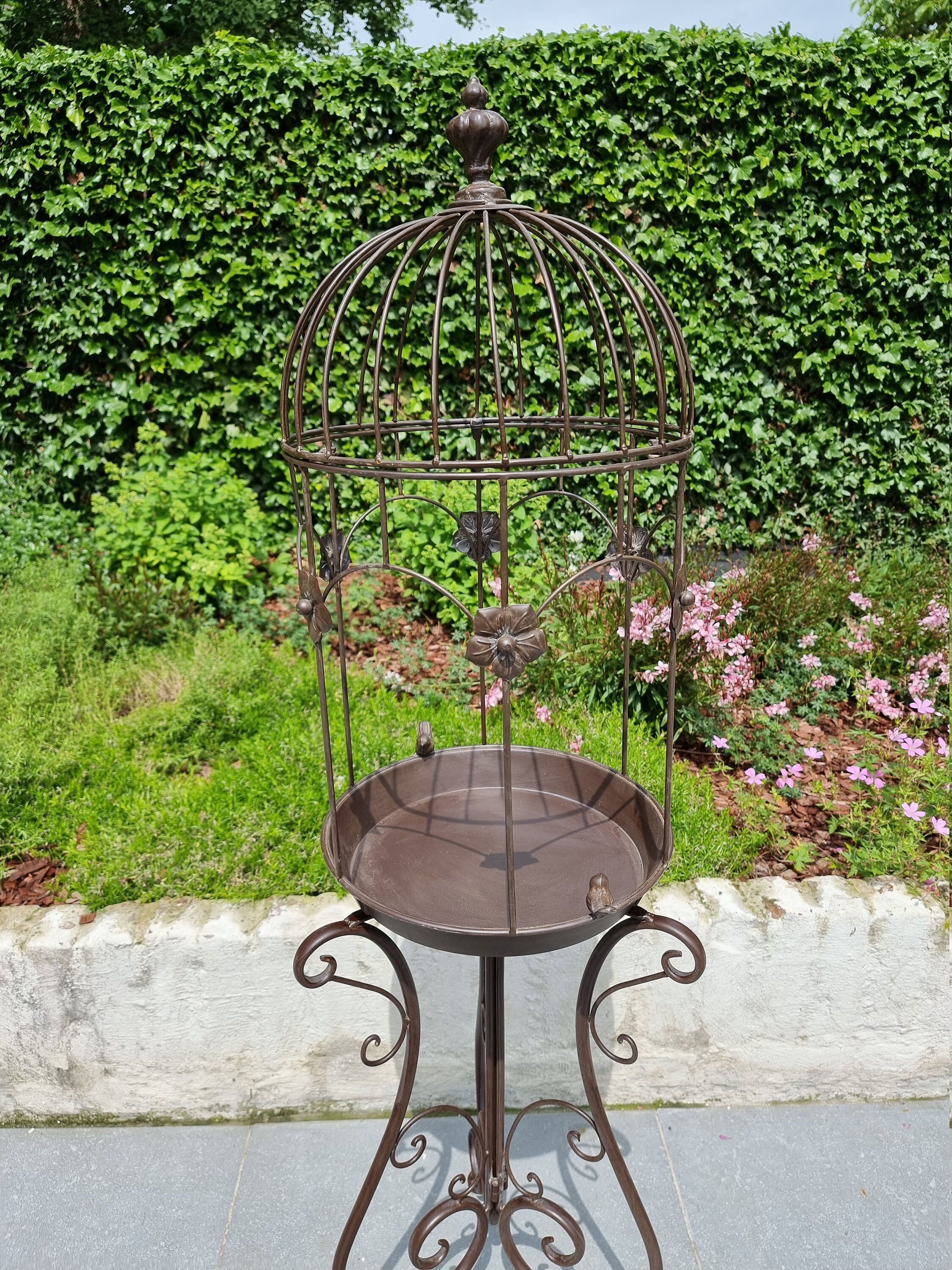 Beautiful large birdbath shaped like an open bird cage Cottage garden decoration Romantic garden