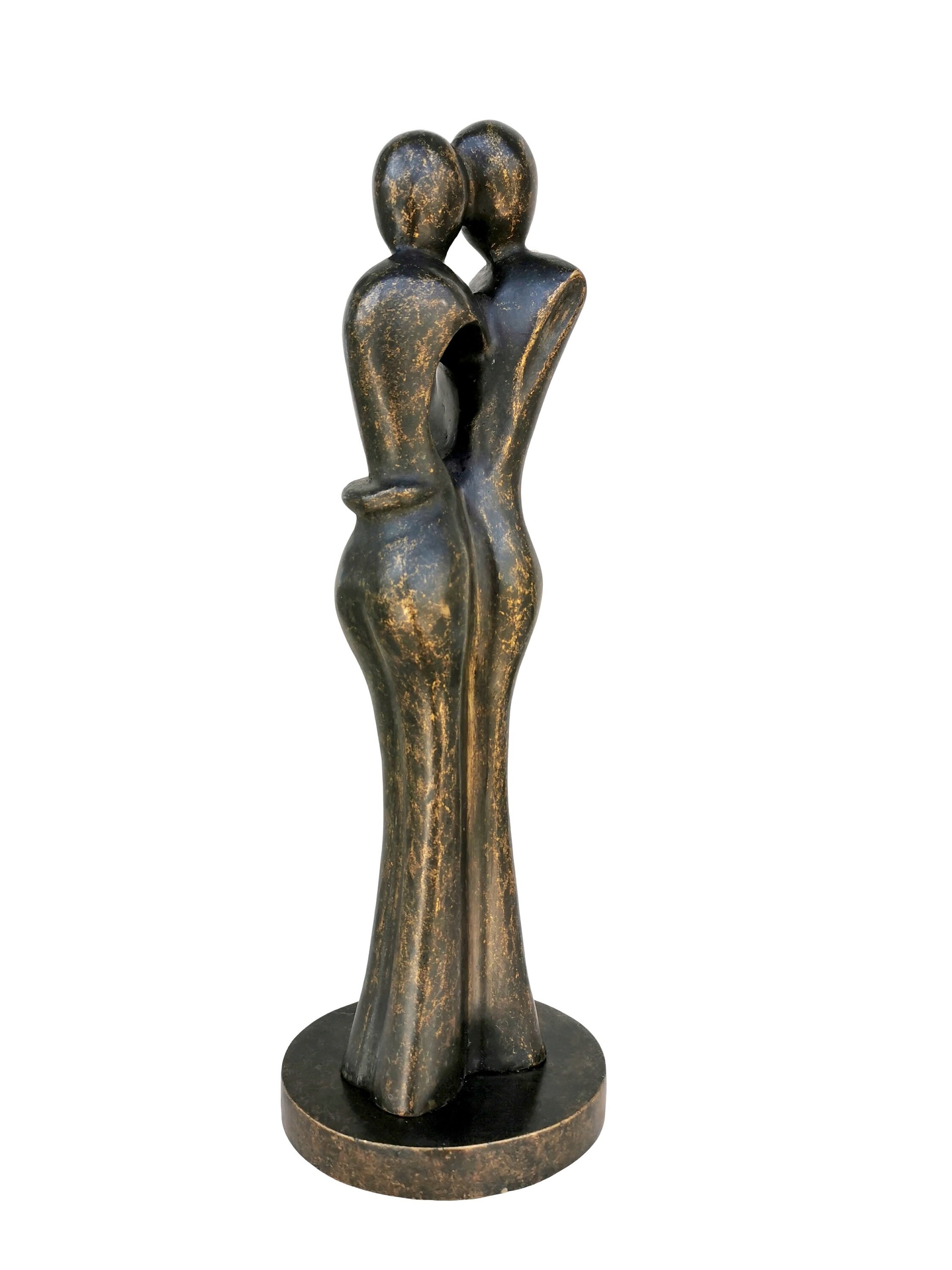 A bronze sculpture of a loving couple