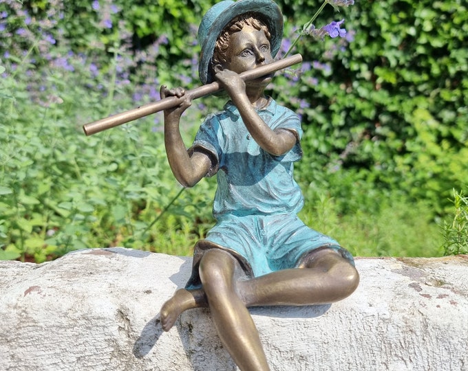 Bronze garden figure - Boy playing the flute - cottage garden