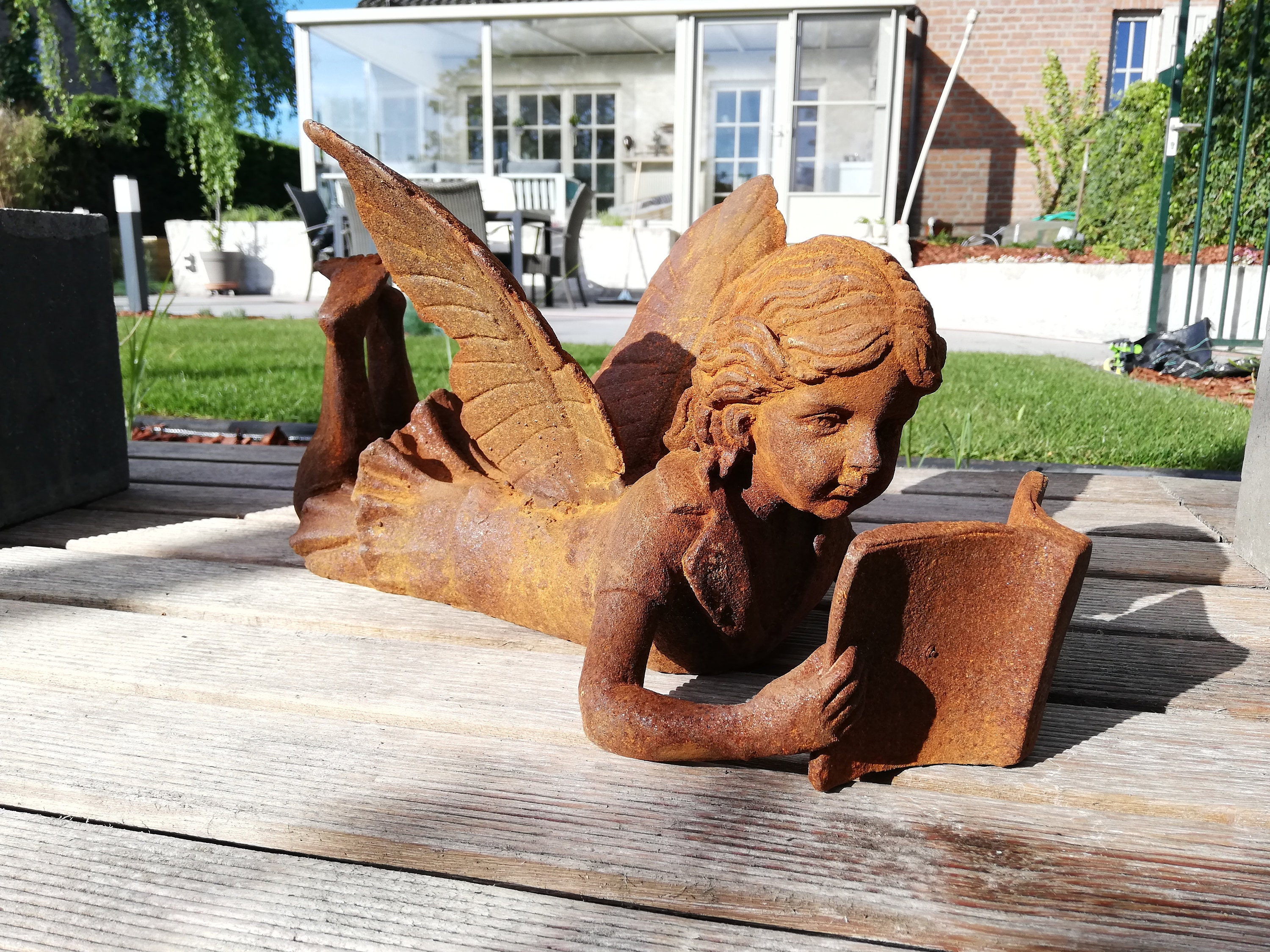 fairy reading a book statue