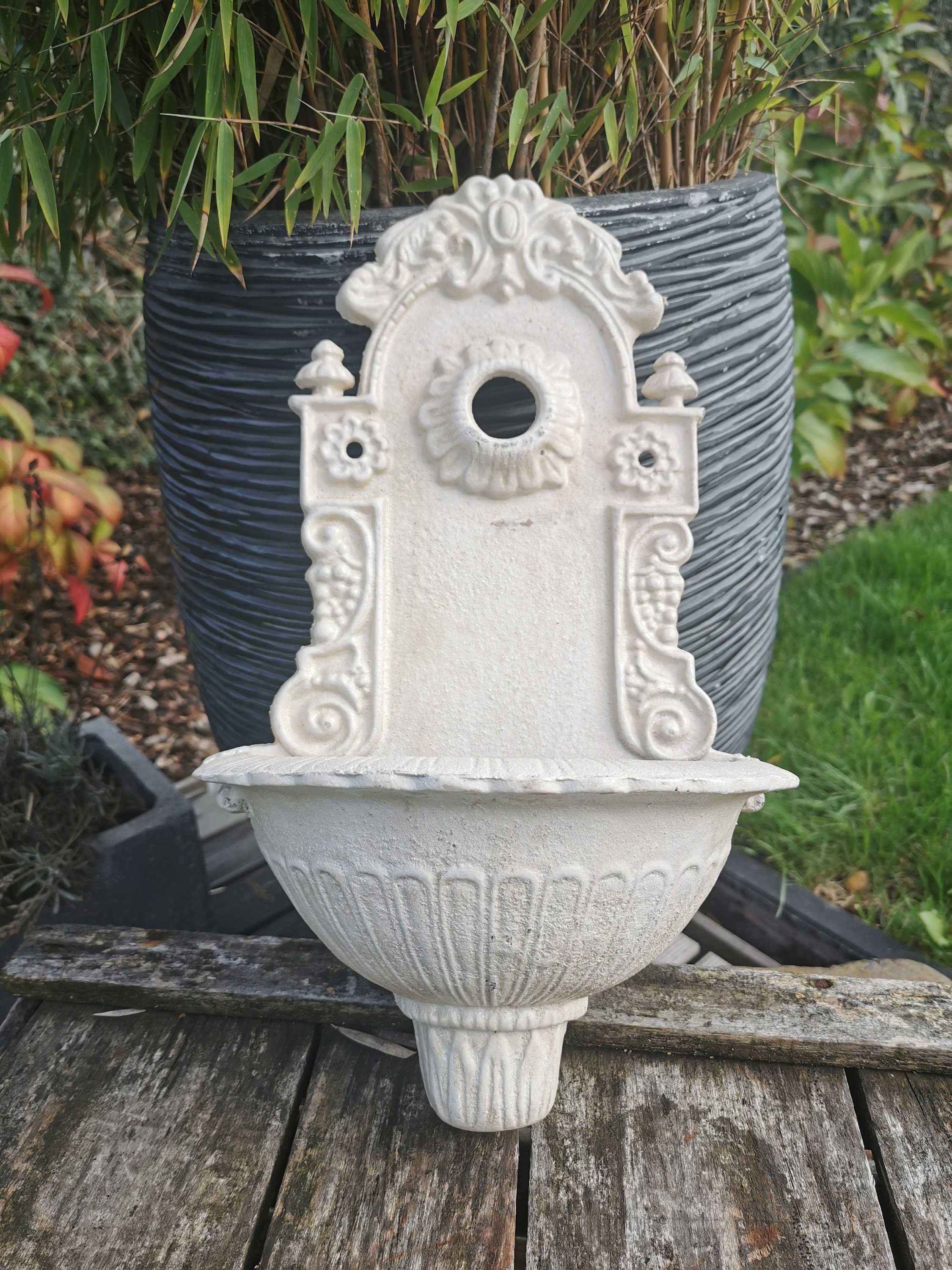 A cast iron wallfountain