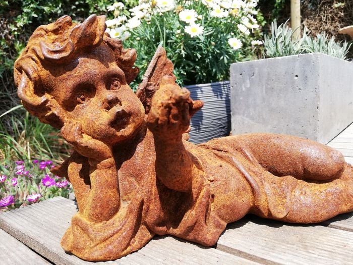 Antique garden sculpture of an Angel (boy)