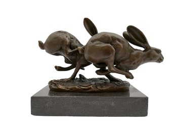 2 running hares in bronze on marble base - hunting lodge decor