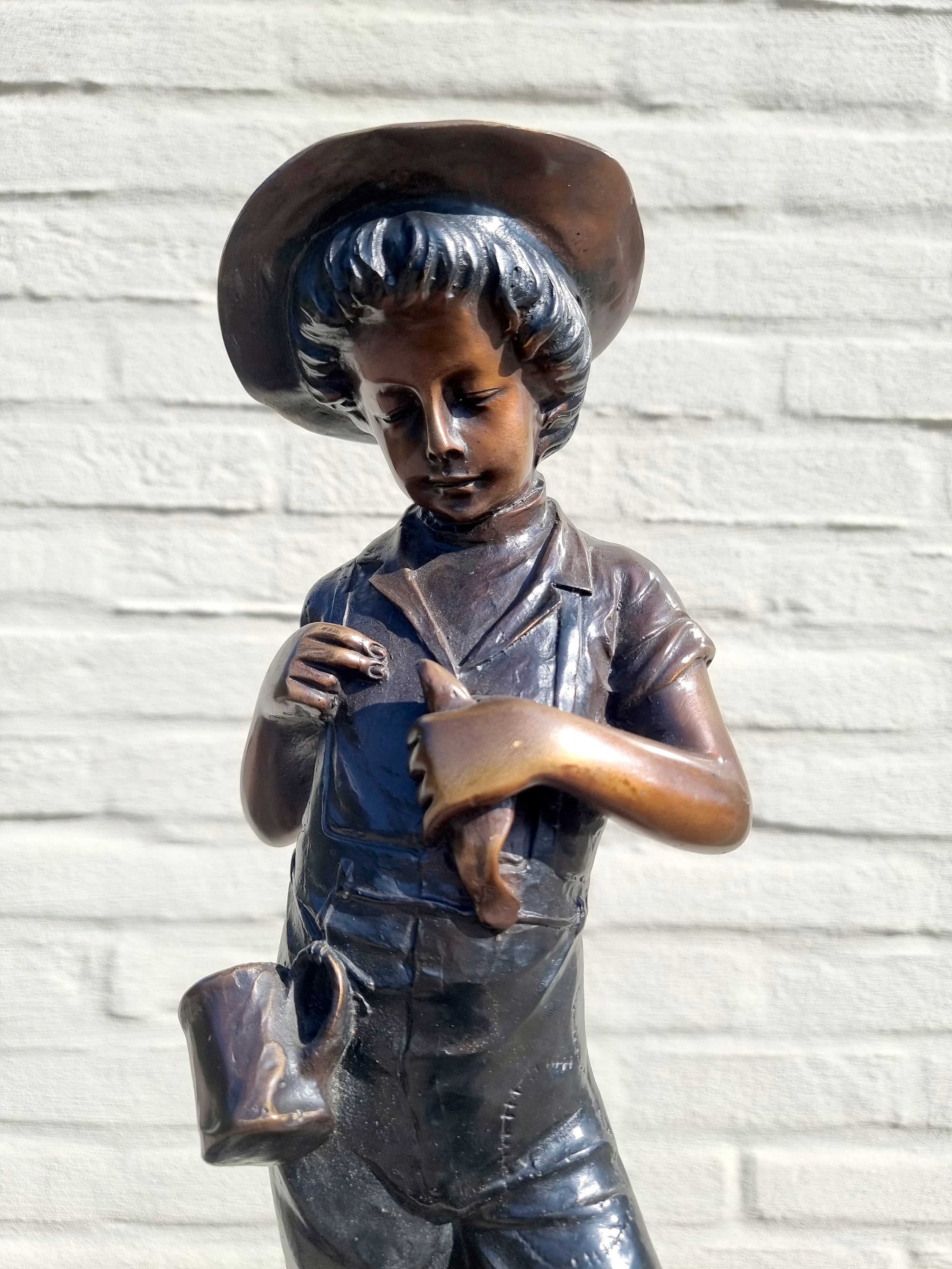 Bronze fisherman Bronze sculpture Boy with fish Boy in the hunt