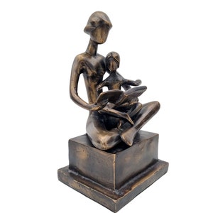 Bronze sculpture -mother love - Mother reads book to child