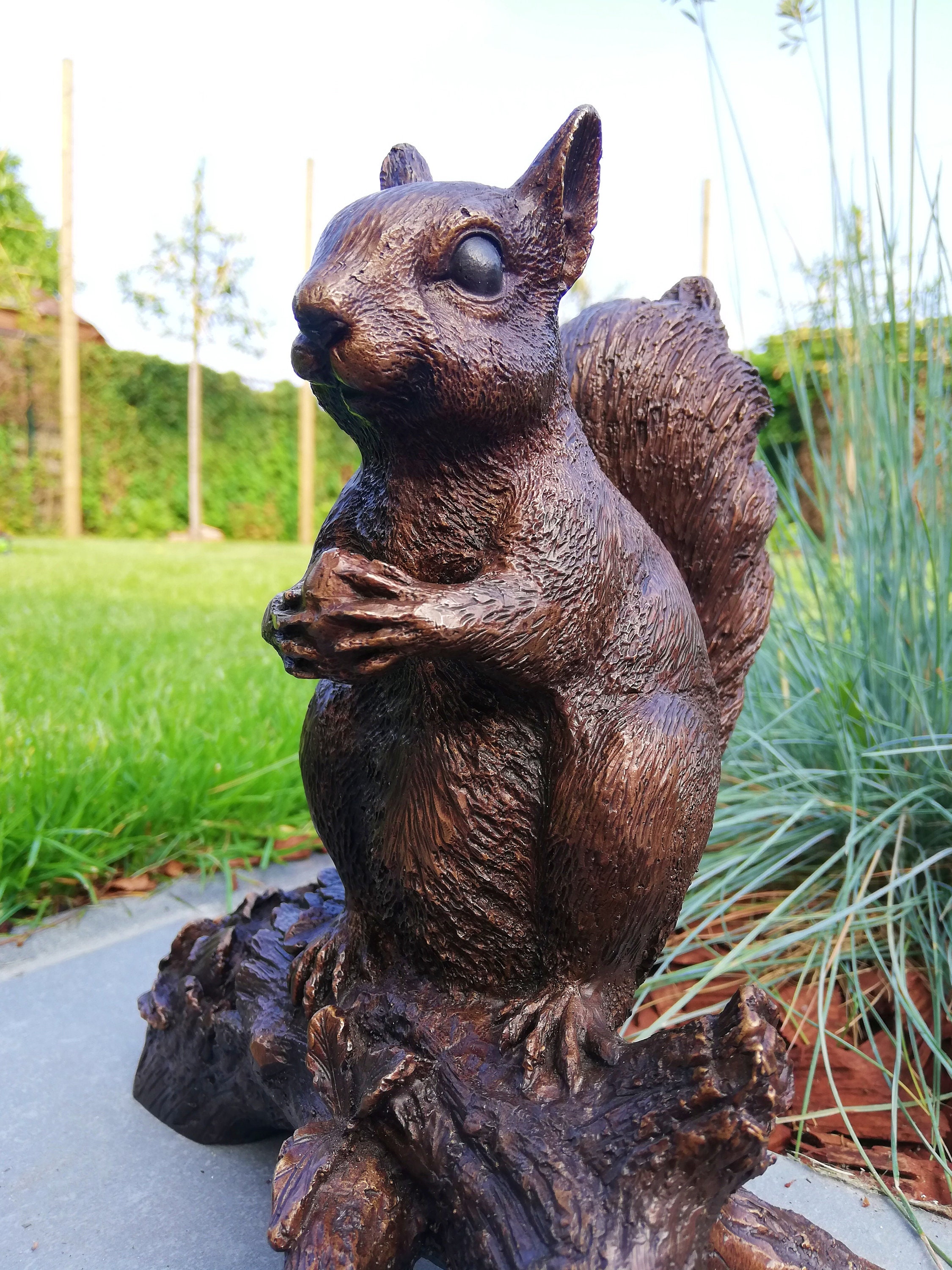 Bronze sculpture of a squirrel on a stump Garden decor Bronze porch