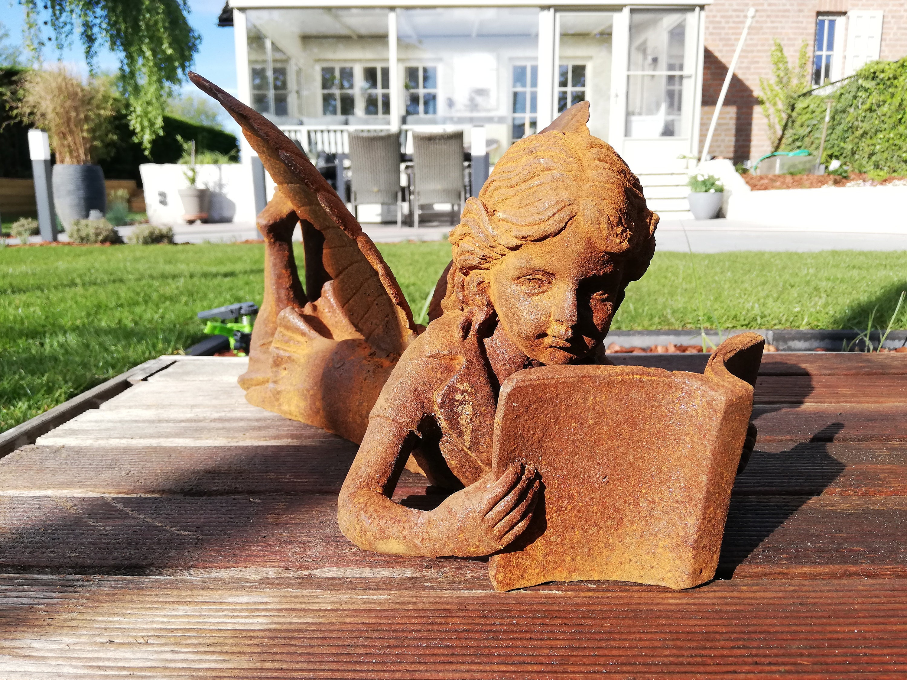 fairy reading a book statue