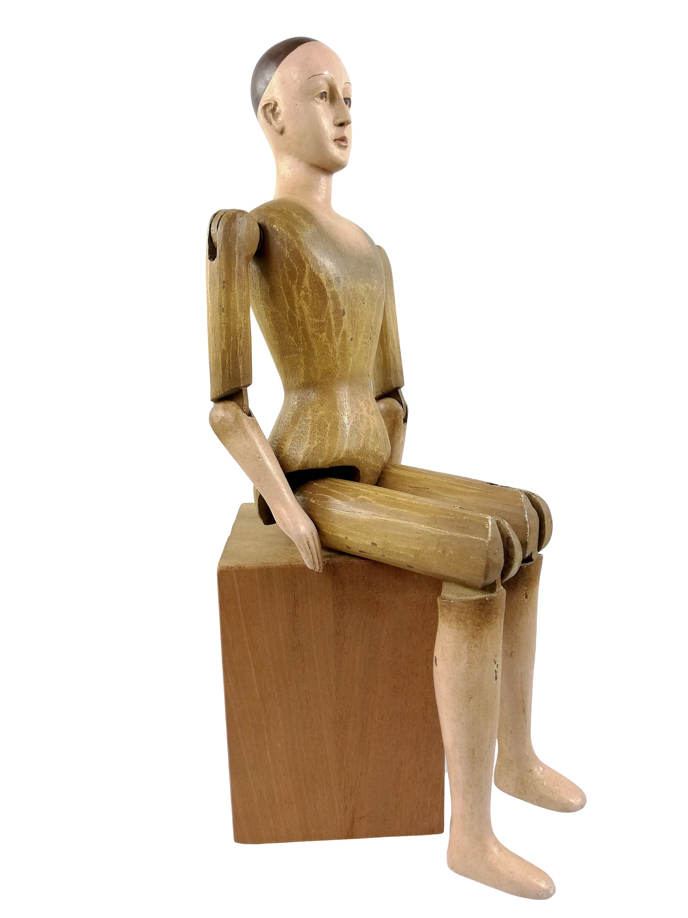 A large wooden mannequin