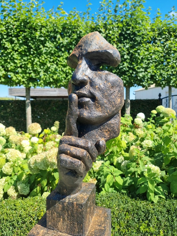 Large abstract sculpture of a male 'whispering' - garden art