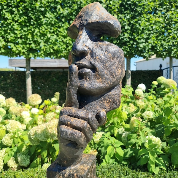 Large abstract sculpture of a male 'whispering' - garden art